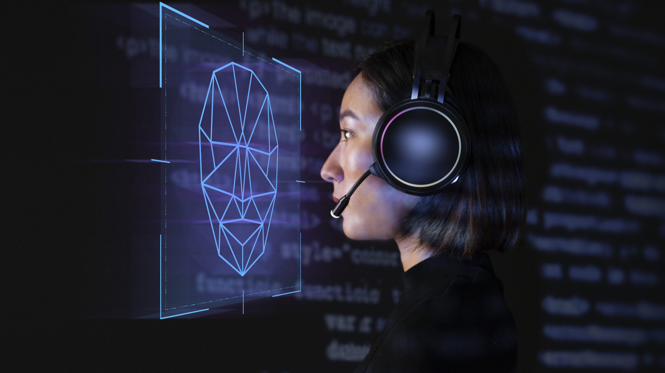 Female programmer scanning her face with biometric security technology